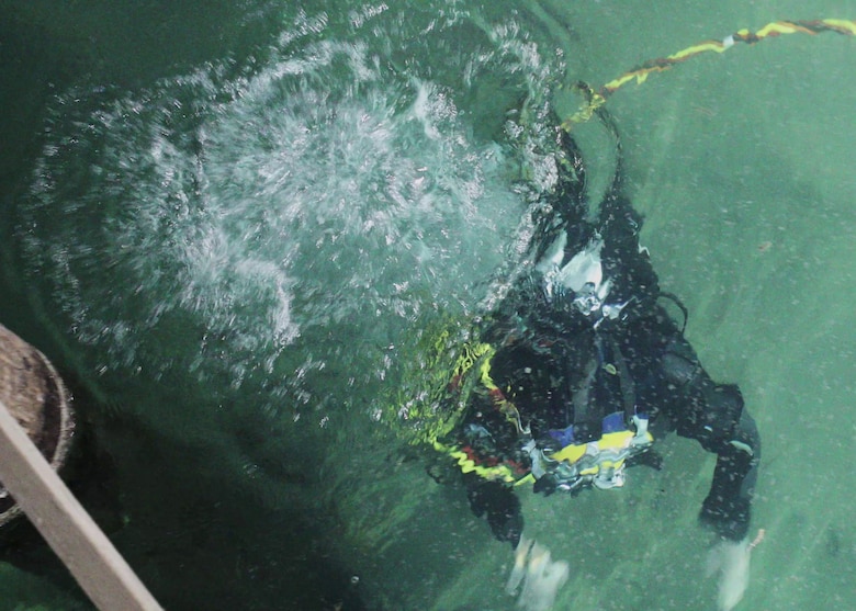 A diver with the U.S. Army Engineer Research and Development Center’s dive team practices using a drysuit underwater during a training exercise.