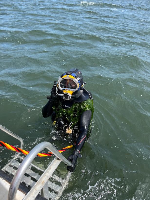A diver with the U.S. Army Engineer Research and Development Center’s dive team returns to the boat after retrieving instrumentation placed off the coast of Long Island, New York.