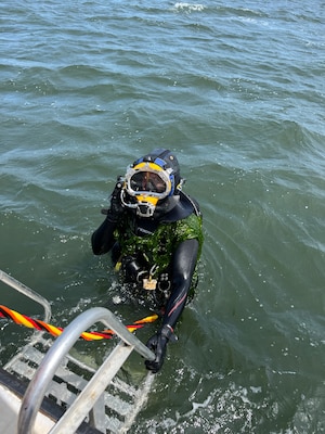 A diver with the U.S. Army Engineer Research and Development Center’s dive team returns to the boat after retrieving instrumentation placed off the coast of Long Island, New York.