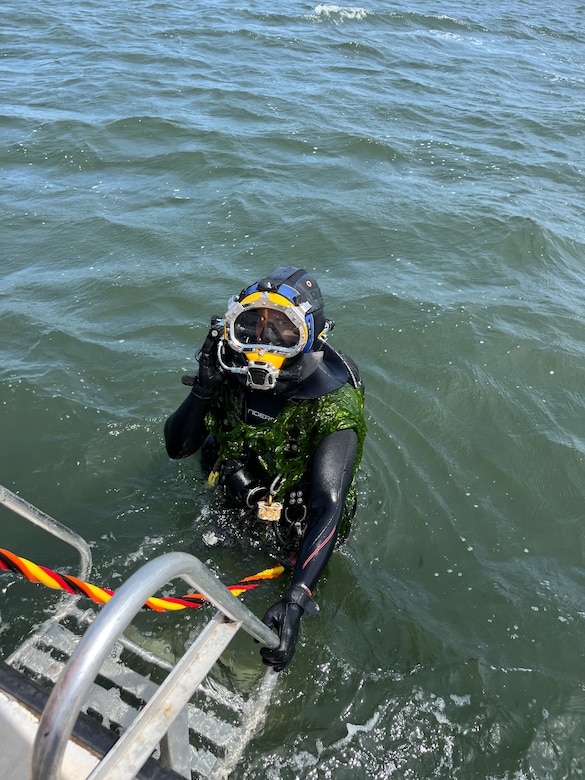 A diver with the U.S. Army Engineer Research and Development Center’s dive team returns to the boat after retrieving instrumentation placed off the coast of Long Island, New York.