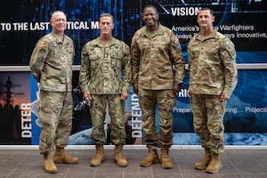 Left, Chief Master Sgt. Richard Dawson, U.S. Space Command senior enlisted adviser of the Human Capital Directorate; U.S. Navy Senior Enlisted Advisor to the Chairman of the Joint Chiefs of Staff (SEAC) David L. Isom; Chief Master Sgt. Jacob Simmons, USSPACECOM command senior enlisted leader; and Sgt. Maj. Chad Stackpole, USSPACECOM commandant, pose for a photo at the USSPACECOM headquarters on Peterson Space Force Base, Colorado, July 30, 2025. While visiting, SEAC Isom met with several senior leaders and directorate staff to gain greater insight into the command’s unique mission and the critical capabilities that space delivers to warfighters.