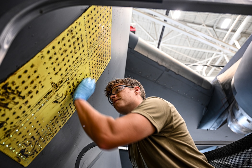 U.S. Air Force Staff Sgt. London Foreman, 445th Maintenance Squadron aircraft structural maintenance journeyman, performs an exterior aircraft skin repair on C-17 Globemaster III at Wright Patterson Air Force Base, Ohio, July 17, 2025. (U.S. Air Force photo by Staff Sgt. Johnathan Quiñones)
