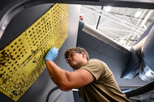 U.S. Air Force Staff Sgt. London Foreman, 445th Maintenance Squadron aircraft structural maintenance journeyman, performs an exterior aircraft skin repair on C-17 Globemaster III at Wright Patterson Air Force Base, Ohio, July 17, 2025. (U.S. Air Force photo by Staff Sgt. Johnathan Quiñones)
