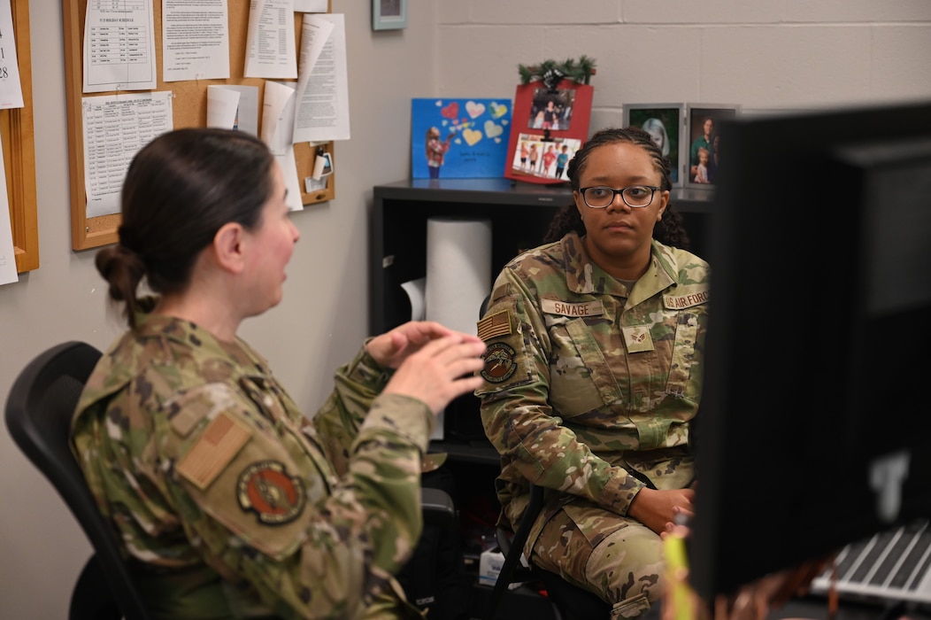 U.S. Air Force Senior Airman Cera Savage, right, 445th Logistics Readiness Squadron supply journeyman, receives education information from Master Sgt. Sandra Parcell, 445th Force Support Squadron Education and Training Air Reserve Technician, at Wright-Patterson Air Force Base, Ohio, July 17, 2025. Savage visited the educational and training office seeking information on education programs, requesting transcripts to apply for an associate’s degree from the Community College of the Air Force and looking for general bachelor’s degree information. (U.S. Air Force photo by Staff Sgt. Johnathan Quiñones)