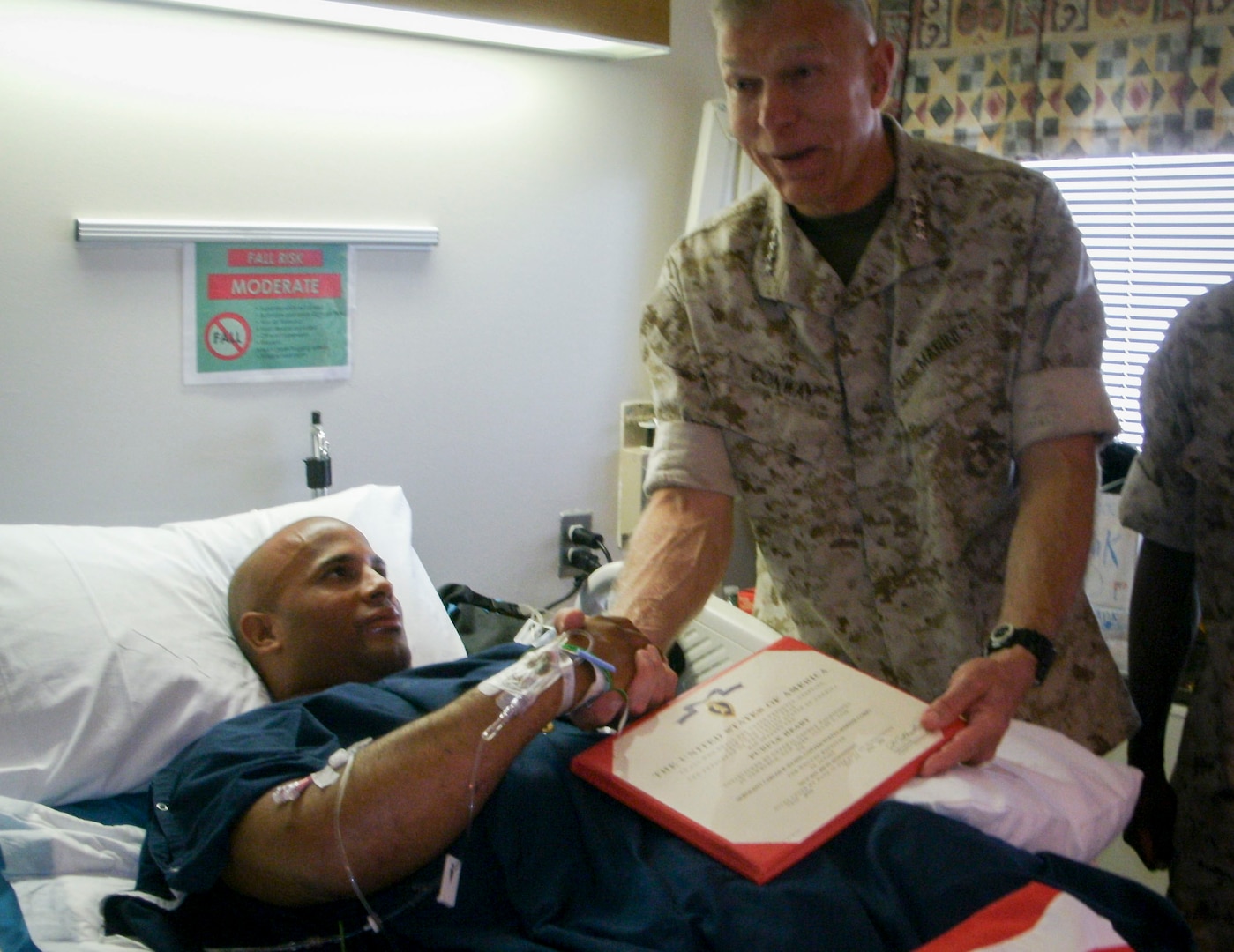 U.S. Marine Corps Sgt. Carlos Evans receives the Purple Heart in 2010, presented by the 34th Commandant of the U.S. Marine Corps Gen. James Conway at Walter Reed. August is Purple Heart Month, and Aug. 7 is observed as Purple Heart Day. Gen. George Washington, then commander in chief of the Continental Army, established what became the Purple Heart on Aug. 7, 1782, at Newburgh, New York.