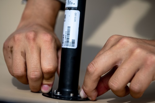 U.S. Air Force Staff Sgt. Andrew Choe, an expeditionary communicator assigned to the Joint Communications Support Element, MacDill Air Force Base, Florida, assembles a Hawkeye 360 satellite during the Air Force’s 2025 Department-Level Exercise series at Andersen Air Force Base, Guam, July 13, 2025. More than 40 JCSE personnel deployed to the Indo-Pacific area of responsibility to provide expeditionary communications support to Air Mobility Command, U.S. Transportation Command, and their Allies and partners. The DLE encompasses all branches of the Department of Defense, Allies, and partners, employing over 400 joint and coalition aircraft and more than 12,000 personnel across more than 50 locations spanning 3,000 miles. (U.S. Air Force photo by Senior Airman Zachary Foster)