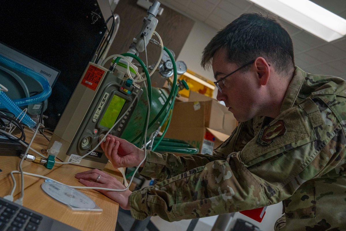 Man works on medical device
