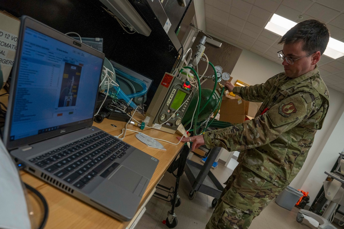 Man in uniform working on oxygen tank
