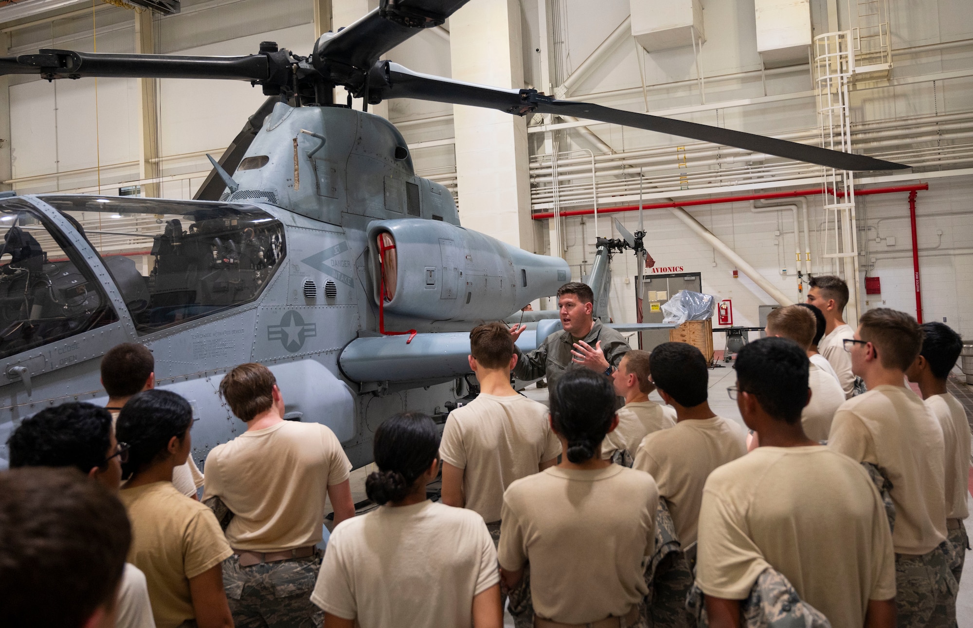 Civil Air Patrol cadets learn about the AH-1Z Viper helicopter inside the Marine Aircraft Group 49 hangar during the 2025 NJ Wing Basic Encampment at Joint Base-McGuire-Dix-Lakehurst, N.J., July 30, 2025.  The week-long encampment aimed to strengthen the cadets’ leadership skills, hone their fitness and character, and prepare them for future career opportunities in aerospace and technology. (U.S. Air Force photo by Susan Moriarty)