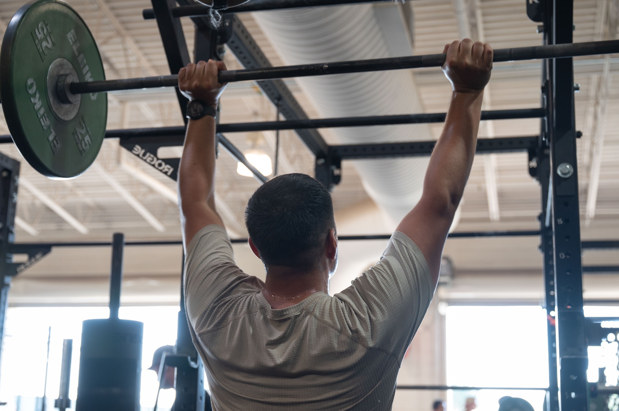 U.S. Air Force Col. Jose Cabrera, 355th Wing commander, right, and Chief Master Sgt. Kelvin Hatcher, 355th Wing command chief, perform box jumps during a memorial workout at Davis-Monthan Air Force Base, August 6, 2025. Cabrera and Hatcher participated in the memorial workout, demonstrating their commitment to DM’s readiness and lethality. (U.S. Air Force photo by Airman Jaden Kidd)