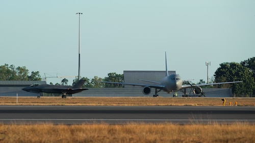 A Royal Australian Air Force F-35A Lightning II aircraft taxis past a U.S. Air Force KC-46 Pegasus aircraft from Travis Air Force Base, California, during an international interfly in support of Talisman Sabre 25 in the Northern Territory, Australia, July 16, 2025. Talisman Sabre is the largest bilateral military exercise between Australia and the United States, that advances a safe and secure Indo-Pacific by strengthening relationships and interoperability among key Allies and partners, while enhancing collective capabilities to respond to a wide array of potential security concerns. (U.S. Air Force photo by Staff Sgt. Alex Lowe)