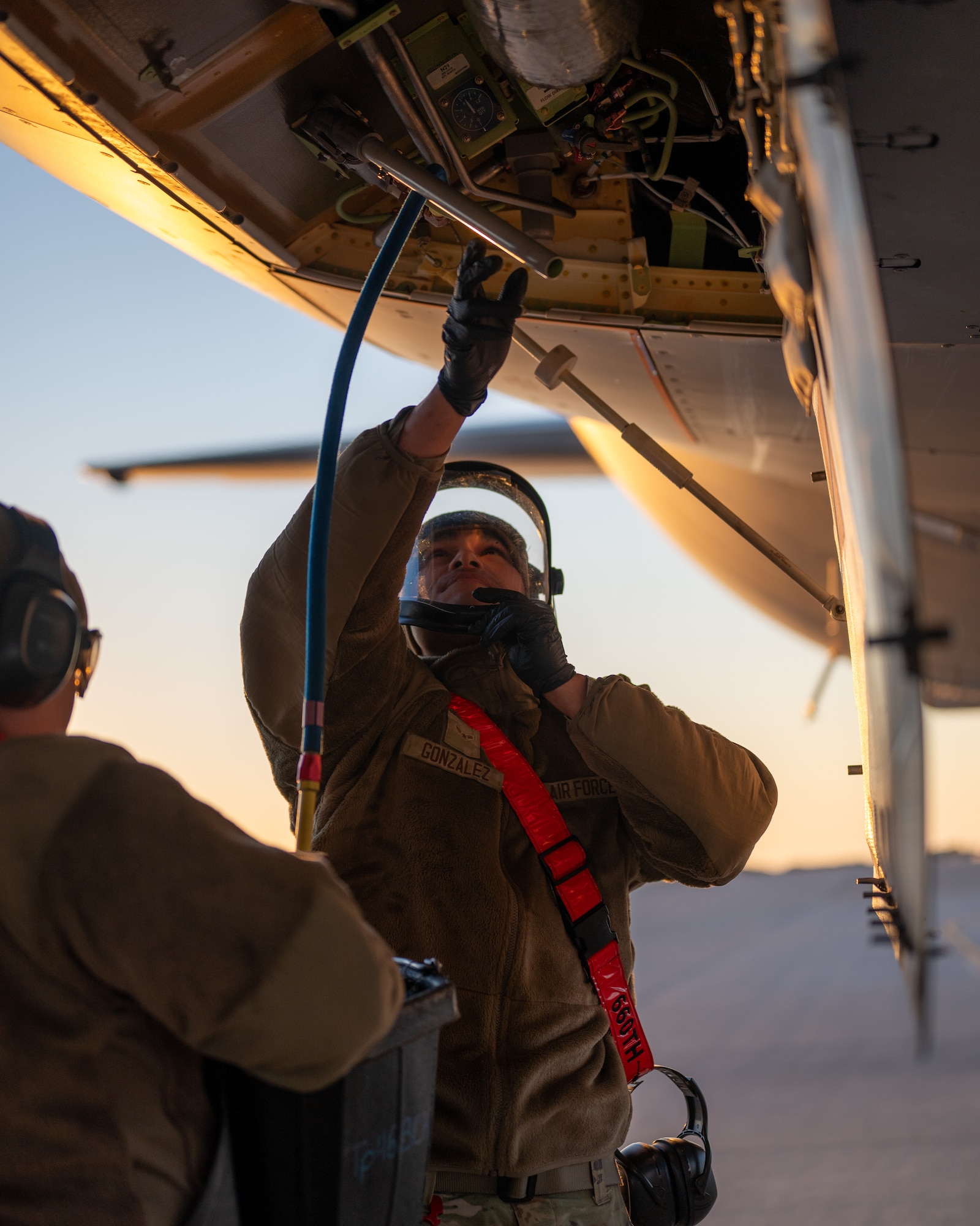 U.S. Air Force Airman 1st Class Diande Gonzalez, 660th Aircraft Maintenance Squadron crew chief, services the hydraulics system of a KC-46A Pegasus on the flight line at Travis Air Force Base, California, July 15, 2025. The KC-46 utilizes a hydraulics system for various flight control systems, including the boom and other critical components. (U.S. Air Force photo by Senior Airman Robert Nichols)