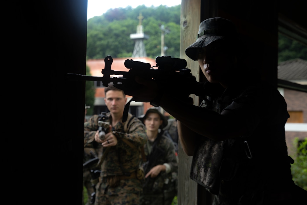 A Republic of Korea Marine clears a room during military operations in urban terrain training during the Korean Marine Exchange Program 25.2 in Pocheon, South Korea, July 22, 2025. KMEP is conducted regularly between the ROK and U.S. Marine Corps to increase their combined capabilities through realistic training geared towards deterring threats and maintaining peace in the Indo-Pacific. (U.S. Marine Corps photo by Lance Cpl. Van Hoang)