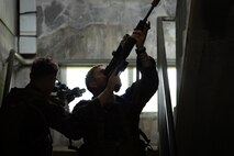 U.S. Marines with 2nd Battalion, 23rd Marines, forward deployed with 4th Marine Regiment, 3d Marine Division as part of the Unit Deployment Program, demonstrate how to clear a stairway during military operations in urban terrain training during the Korean Marine Exchange Program 25.2 in Pocheon, South Korea, July 22, 2025. KMEP is conducted regularly between the ROK and U.S. Marine Corps to increase their combined capabilities through realistic training geared towards deterring threats and maintaining peace in the Indo-Pacific. (U.S. Marine Corps photo by Lance Cpl. Van Hoang)