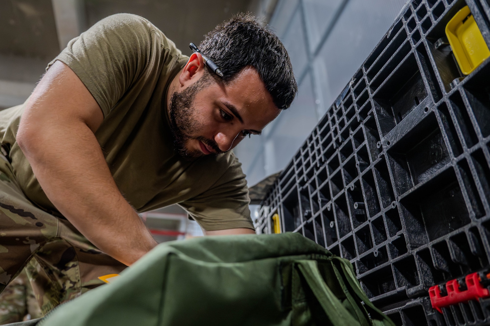 Airman equips bag.