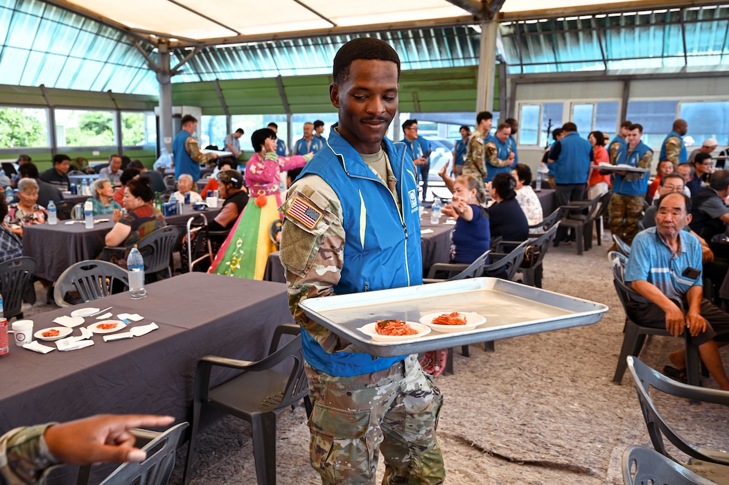 U.S. Army Soldiers from 2-23IN, 1SBCT, 4ID, work alongside Korean volunteers to distribute food to local seniors during a People to People International event in Pocheon, South Korea, Aug. 7, 2025. The program aimed to uplift community morale through service and cultural exchange.