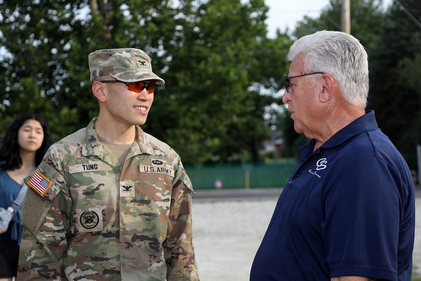 Col. Christopher Tung, left, G3, 85th U.S. Army Reserve Support Command, meets Mayor Frank Saverino, Mayor, Carol Stream, during the American Legion, Post 76, Great Lakes Regional Baseball Tournament, August 6, 2025, in Carol Stream, Illinois.