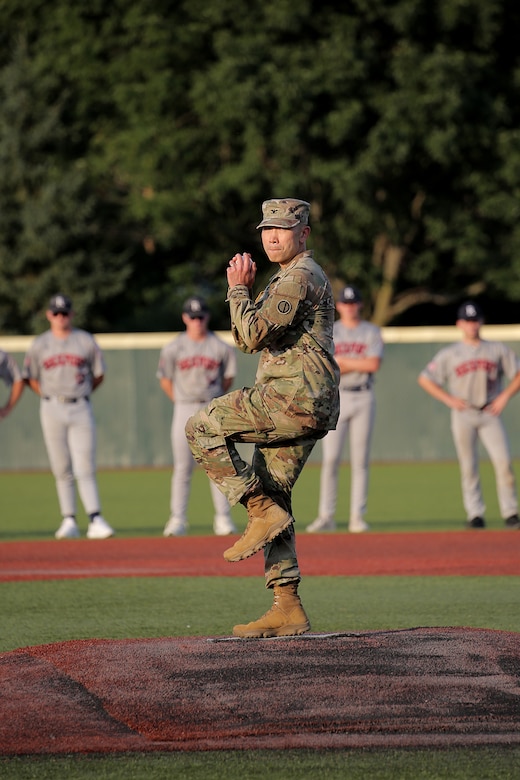 Col. Christopher Tung, G3, 85th U.S. Army Reserve Support Command, throws in a ceremonial first pitch, ahead of the week-long tournament, during the American Legion, Post 76, Great Lakes Regional Baseball Tournament, August 6, 2025, in Carol Stream, Illinois.