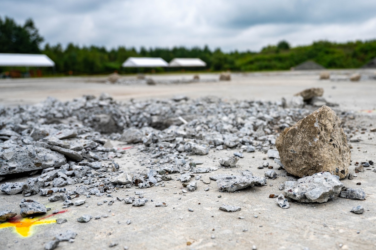 Debris near a crater created for Rapid Airfield Damage Repair training awaits to be cleared during exercise Resolute Force Pacific 2025 at Chitose Air Base, Japan, July 28, 2025.