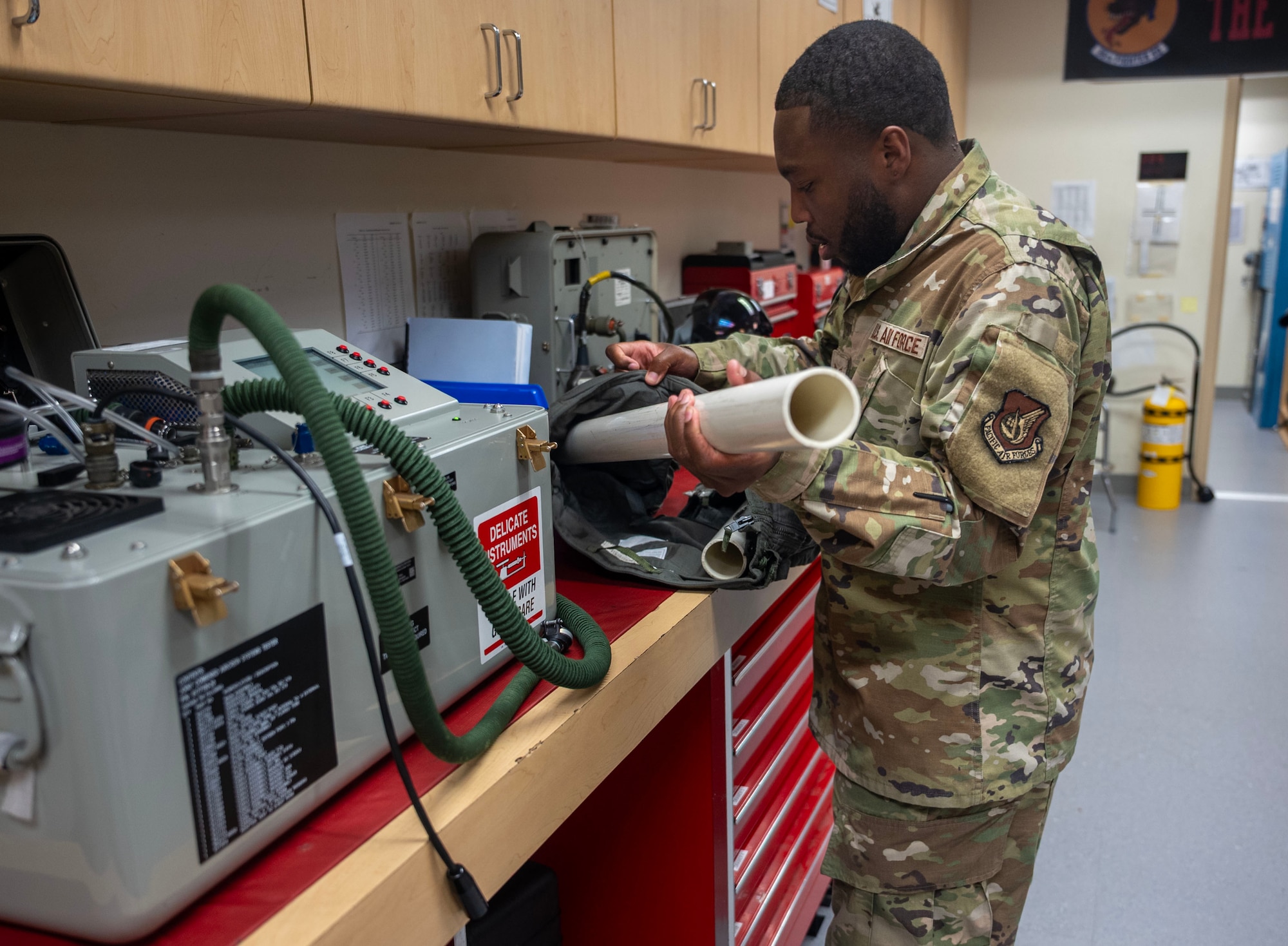 U.S. Air Force Senior Airman Tyreik Profit, 51st Operational Support Squadron aircrew flight equipment technician, tests a flight suit at Osan Air Base, Republic of Korea, Aug. 5, 2025. Profit committed himself to taking resiliency trainer courses to be able to help people around him and equip Airmen with the tools to navigate both personal and professional obstacles. (U.S. Air Force photo by Staff Sgt. Sarah Williams)