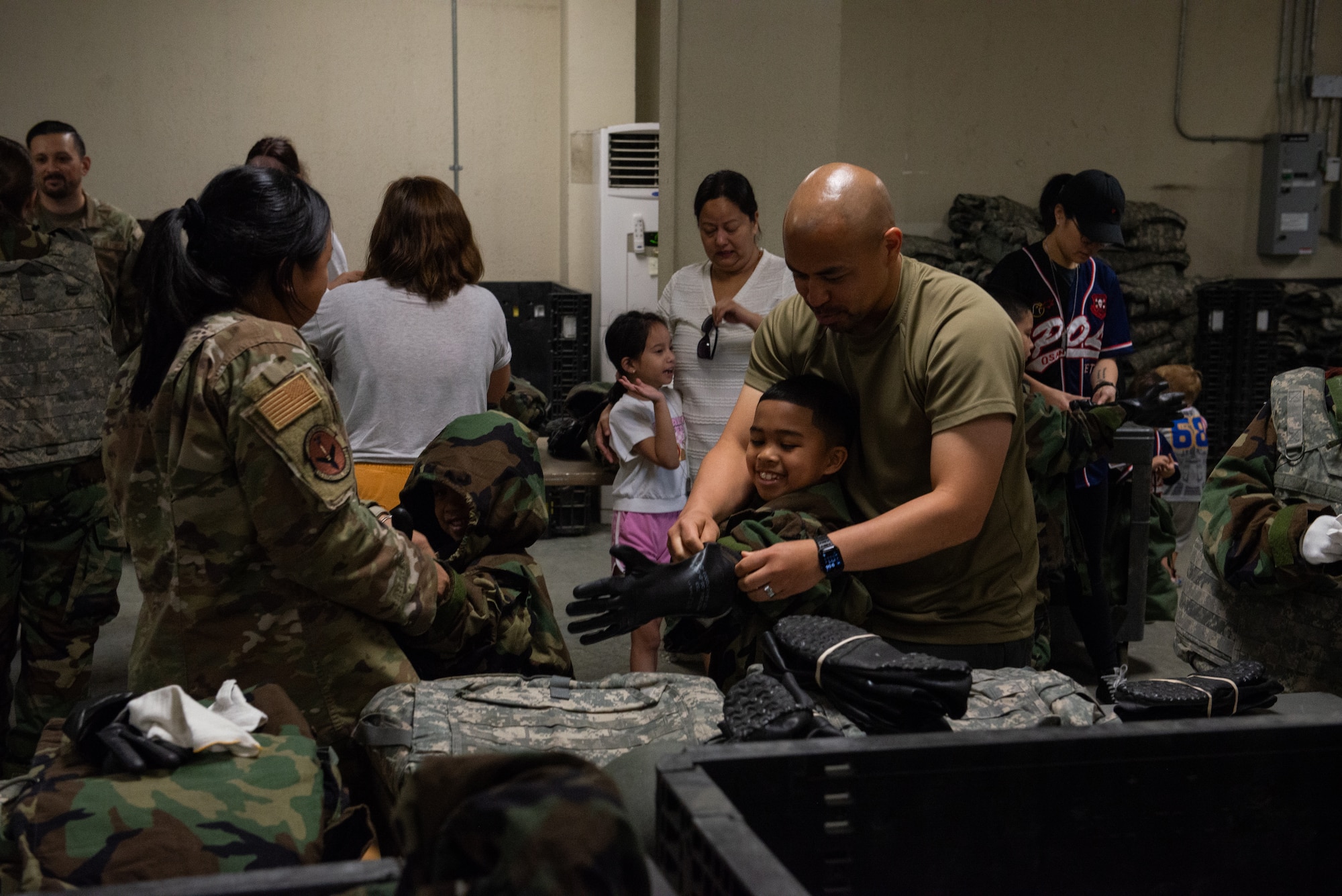 Family members don MOPP gear.