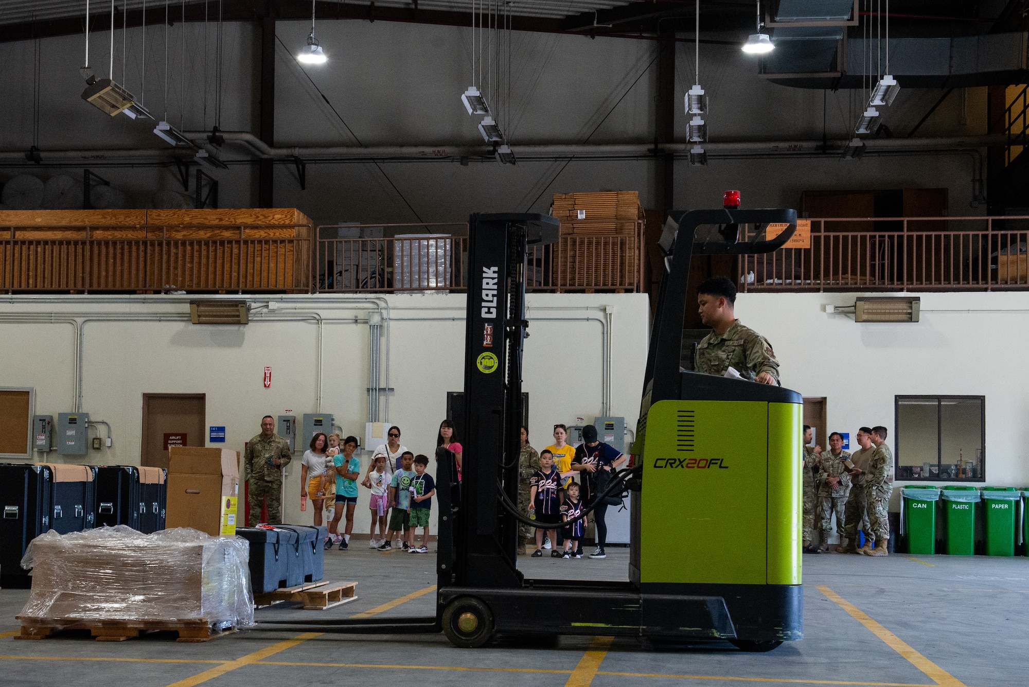 An Airman drives a forklift.