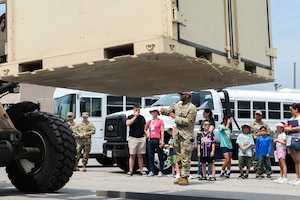 An Airman maneuvers a forklift.