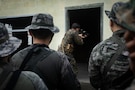 U.S. Marine Corps Sgt. Matthew Roderick, a squad leader with 2nd Battalion, 23rd Marines, forward deployed with 4th Marine Regiment, 3d Marine Division as part of the Unit Deployment Program, demonstrates to Republic of Korea Marines entry techniques during military operations in urban terrain training during the Korean Marine Exchange Program 25.2 in Pocheon, South Korea, July 22, 2025. KMEP is conducted regularly between the ROK and U.S. Marine Corps to increase their combined capabilities through realistic training geared towards deterring threats and maintaining peace in the Indo-Pacific. (U.S. Marine Corps photo by Lance Cpl. Van Hoang)
