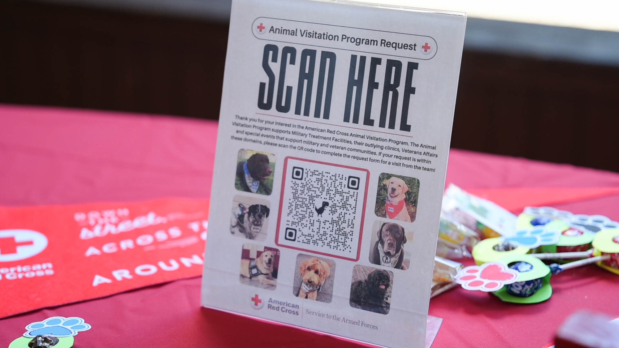 A poster with a QR code advertising animal visitation program request.