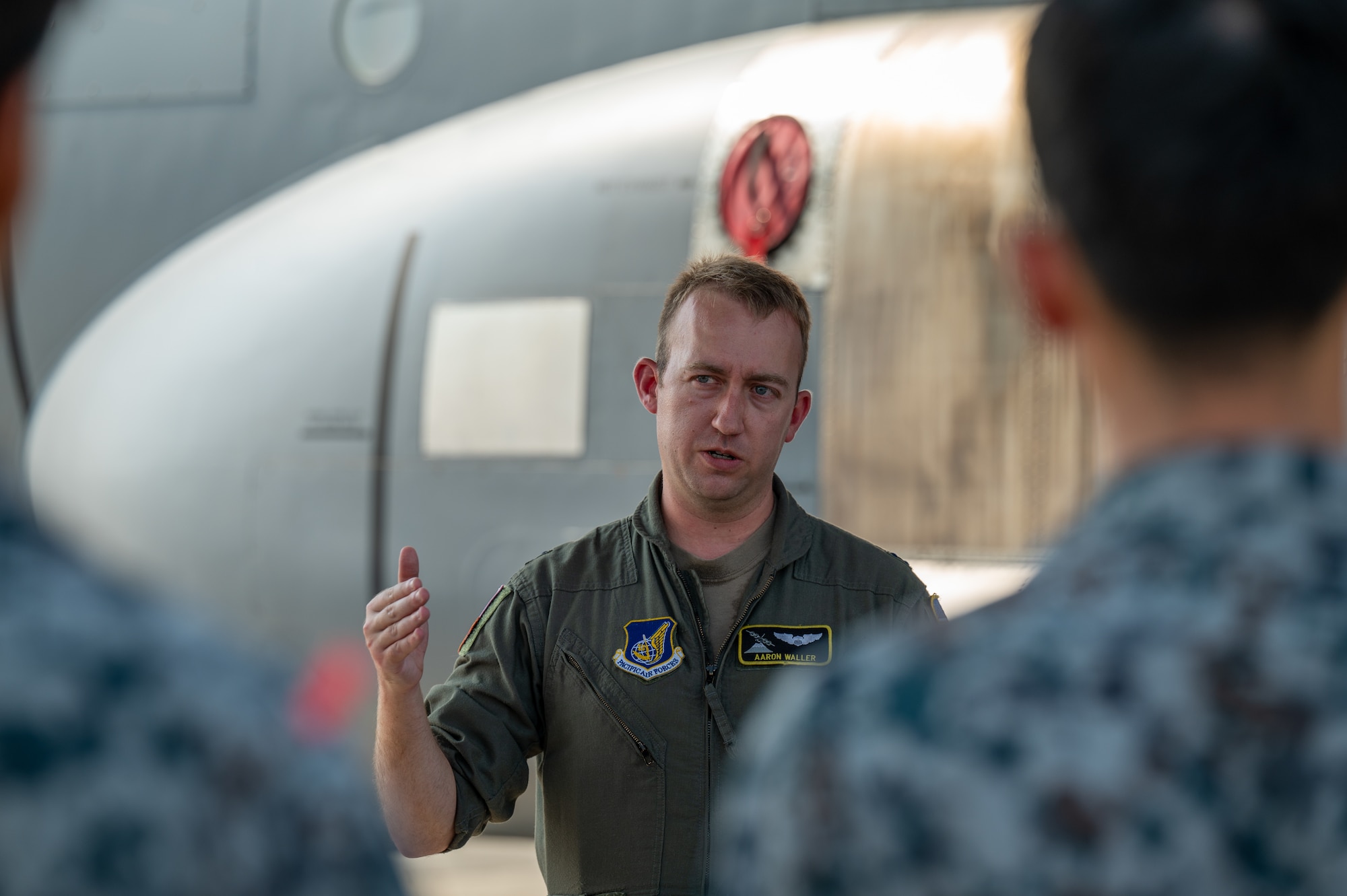 U.S. Air Force Capt. William Waller, 36th Airlift Squadron C-130J Super Hercules pilot, speaks to newly assigned members from the Japan Air Self-Defense Force Operations Support Wing and Air Intelligence Wing during a static display tour of a C-130J at Yokota Air Base, Japan.