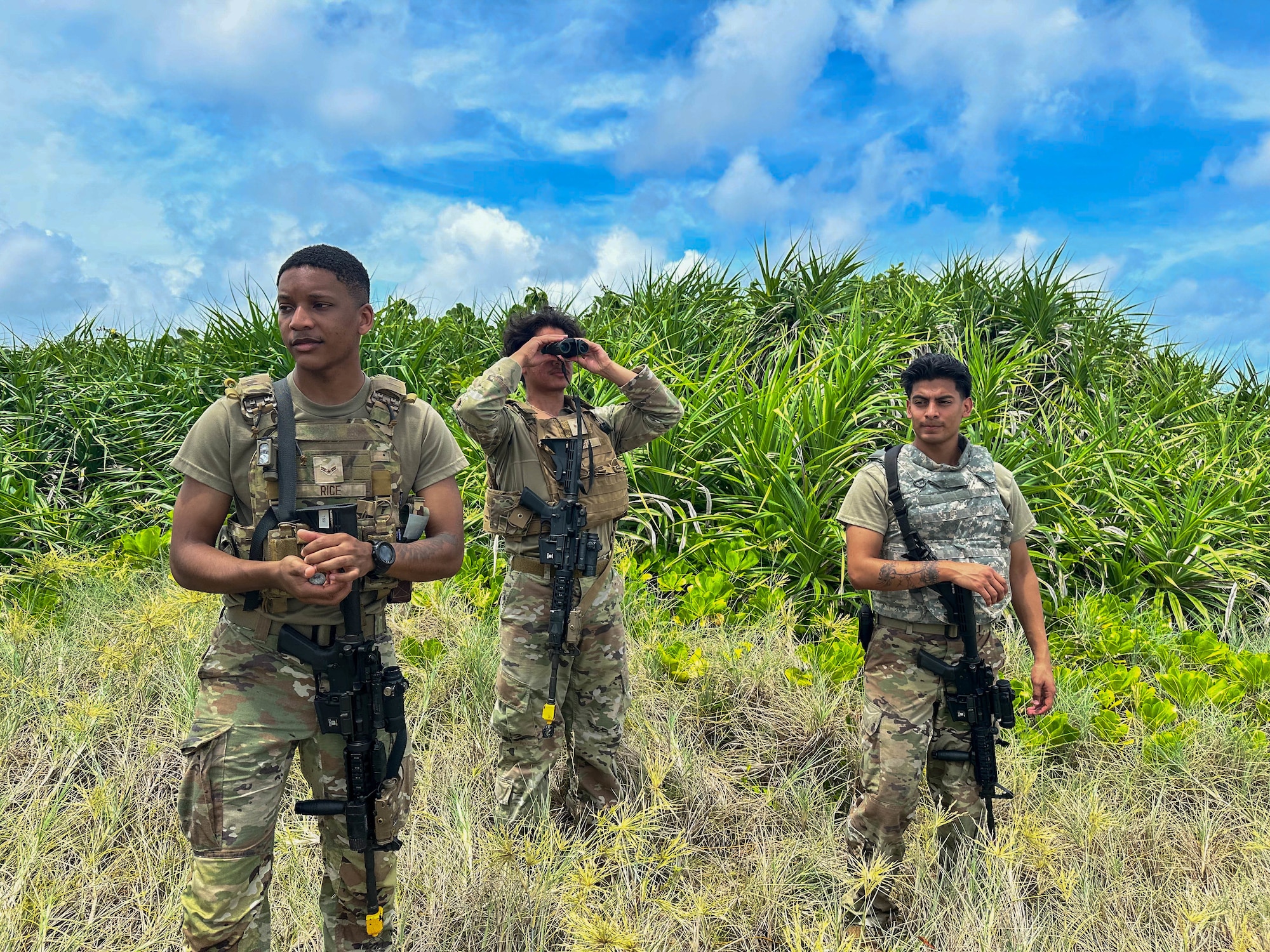 Service members doing simulated perimeter patrol.