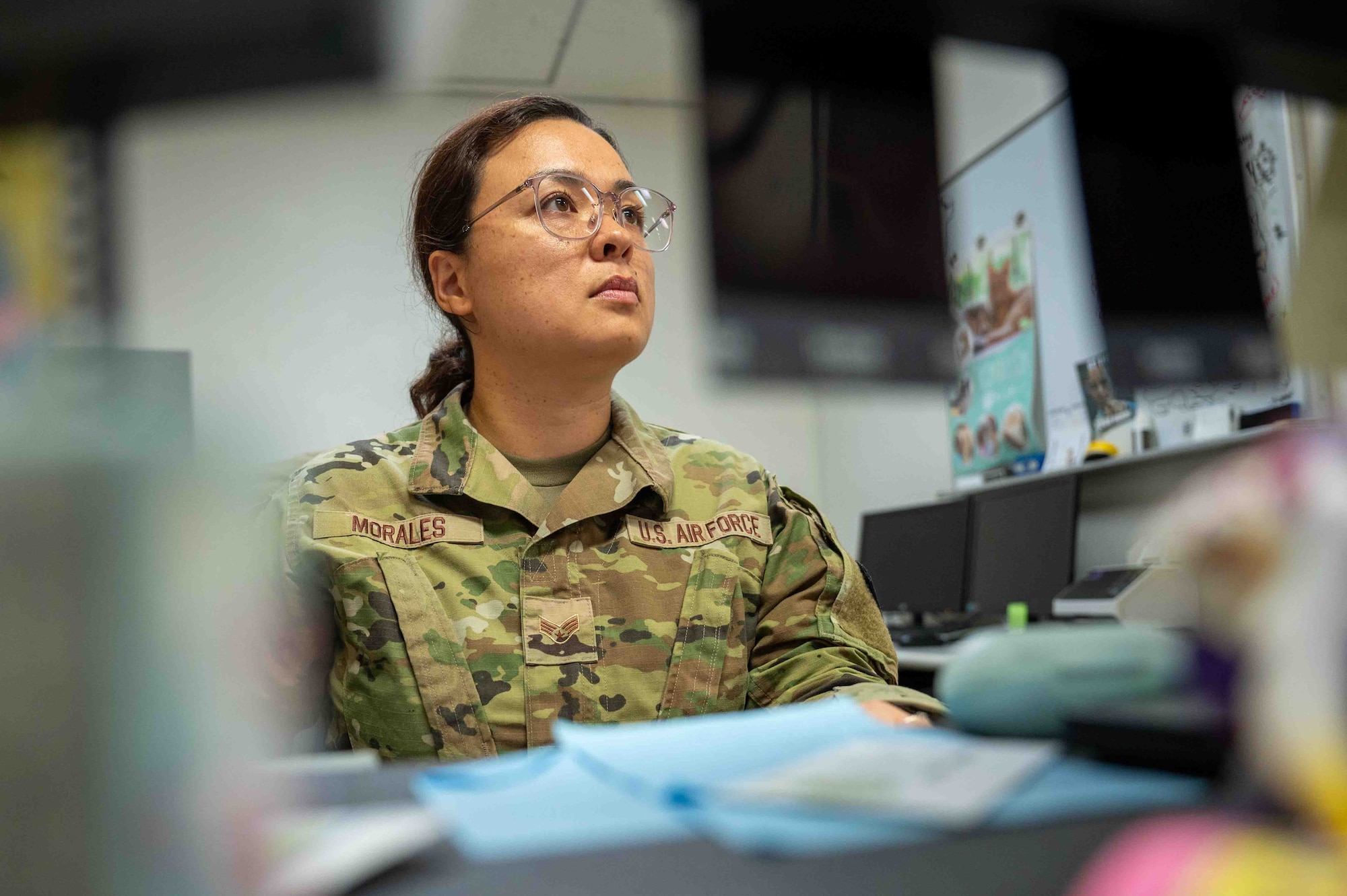 U.S. Air Force Senior Airman Reina Morales, 18th Operational Medical Readiness Squadron public health technician, looks at her computer on Kadena Air Base, Japan, Aug. 6, 2025.