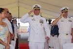 NAVAL STATION ROTA, Spain - (August 07, 2025) Capt. Alexander Mamikonian, commodore of Destroyer Squadron (DESRON) 60 (center), is piped onto the stage as the keynote speaker for the Arleigh Burke-class guided-missile destroyer USS Bulkeley’s (DDG 84), change of command ceremony August 7, 2025. As the 