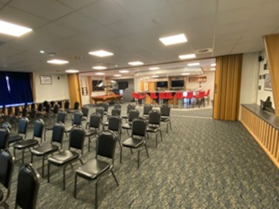 an auditorium with chairs