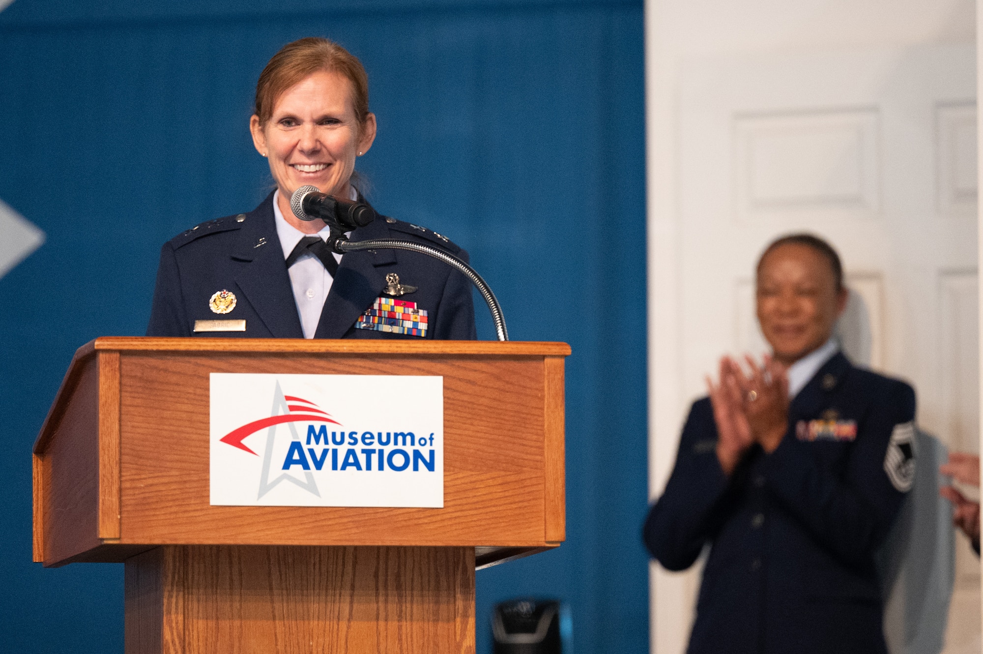 Woman speaking at a podium
