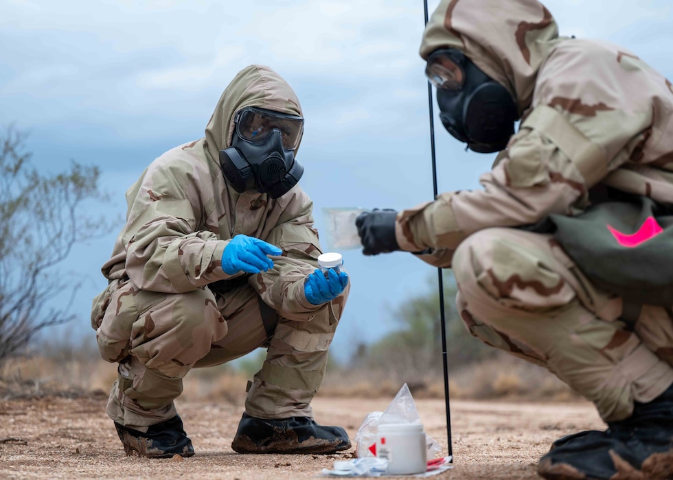 Airman collecting sample