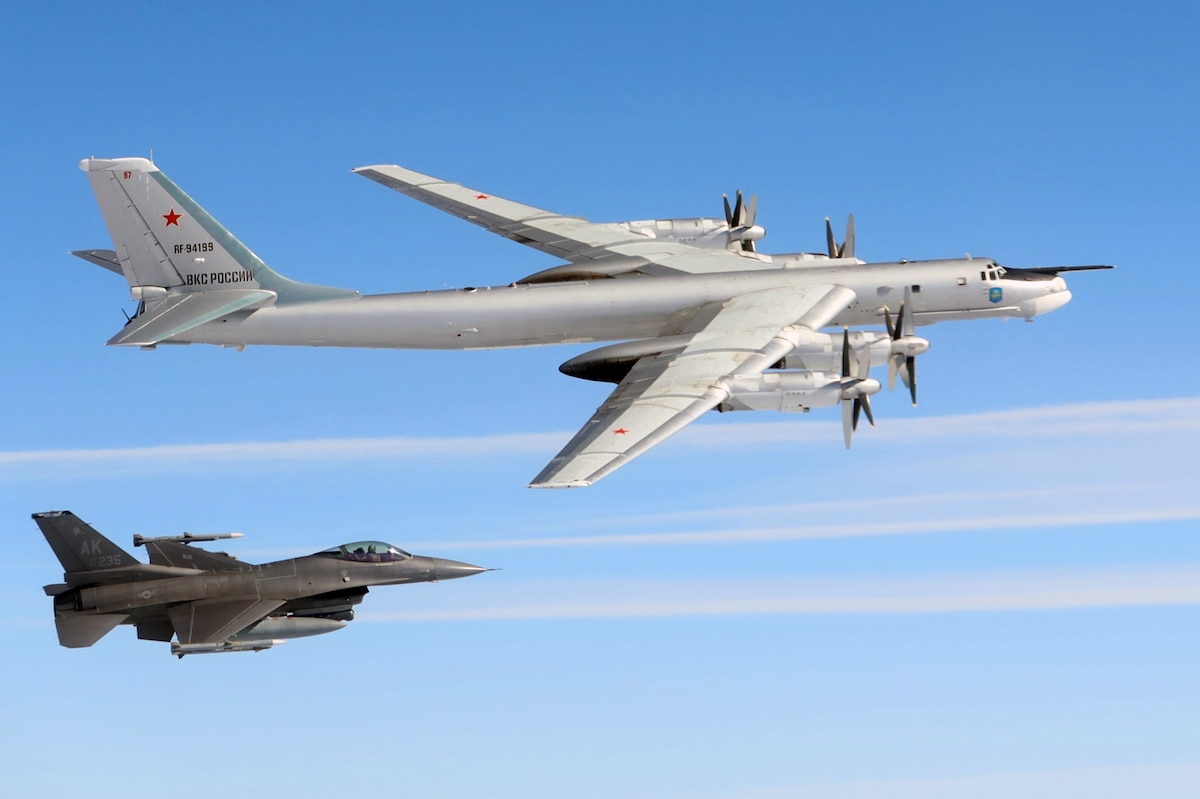 A U.S. Air Force F-16 Fighting Falcon assigned to the North American Aerospace Defense Command (NORAD) intercepts a Russian Tu-95 bomber over the Bering Sea, July 22, 2025. The intercept occurred after the Tu-95 entered the Alaskan Air Defense Identification Zone, a monitored airspace where foreign military aircraft are tracked to ensure national security and situational awareness. (U.S. Department of Defense photo)