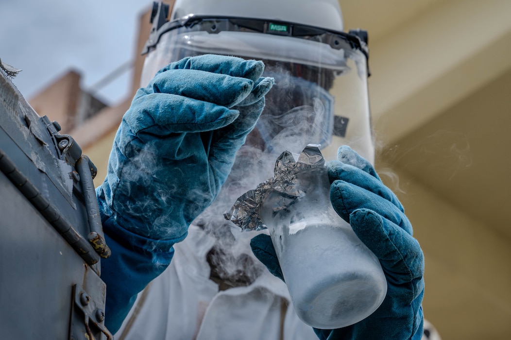 Airman collects a liquid oxygen test sample
