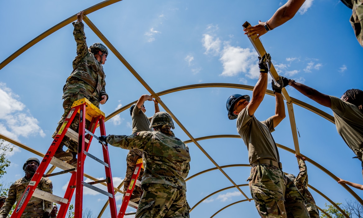 Airmen building a tent