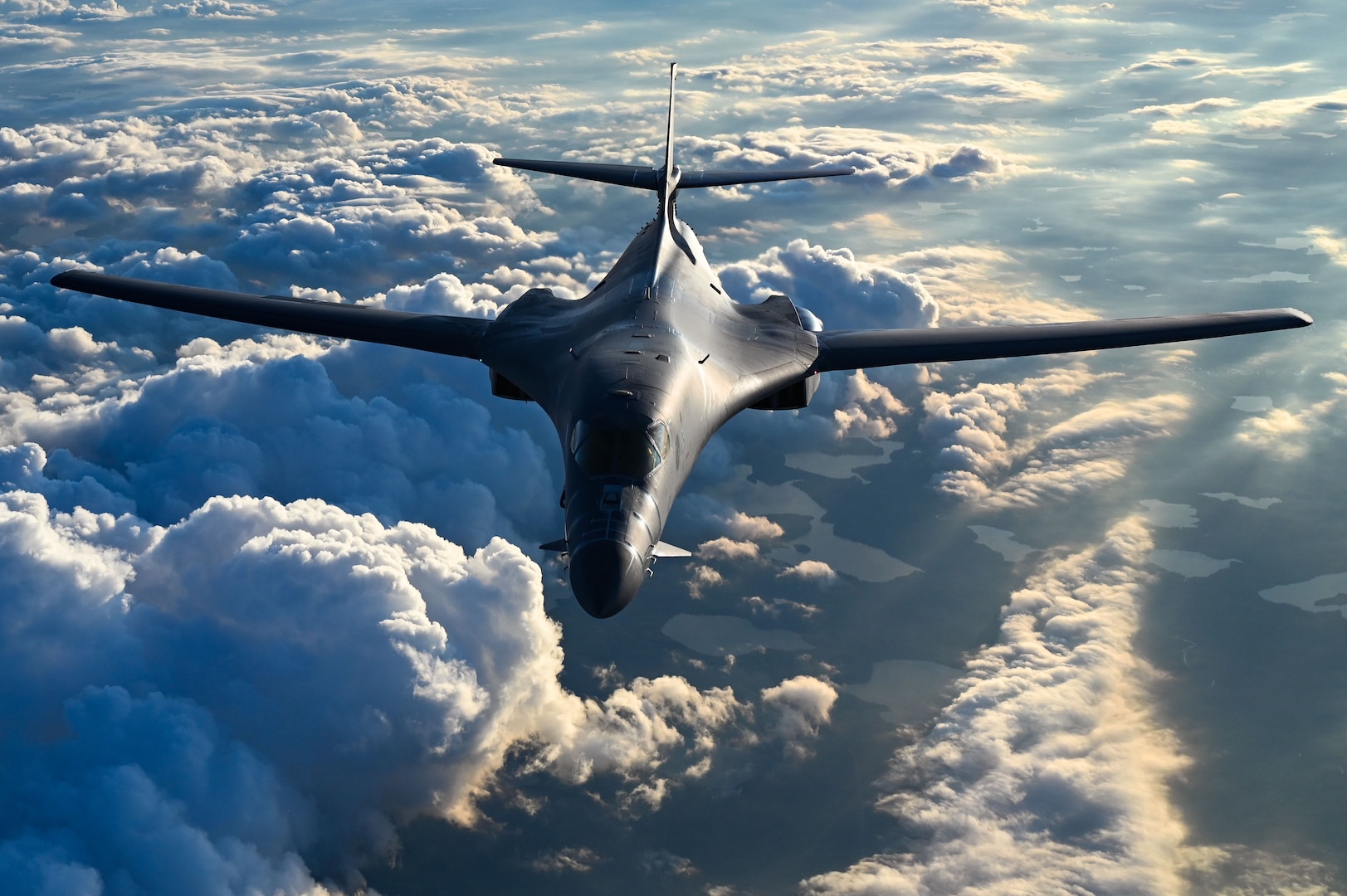 B1-B Lancer in flight surrounded by clouds