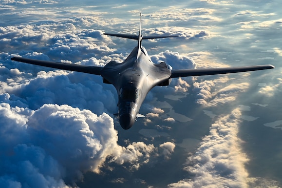 B1-B Lancer in flight surrounded by clouds
