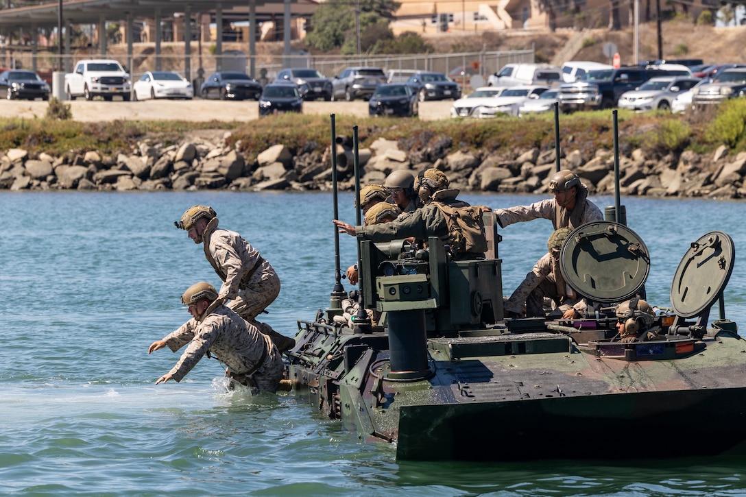 U.S. Marines with 3rd Battalion, 5th Marine Regiment, 1st Marine Division, I Marine Expeditionary Force, rehearse amphibious combat vehicle egress procedures during the Water Integration Training Program on Marine Corps Base Camp Pendleton, California, July 24, 2025. The Marines completed the WITP to develop and sustain essential amphibious skills to support the mission of the 11th Marine Expeditionary Unit, I MEF. (U.S. Marine Corps photo by Cpl. Oliver Nisbet)