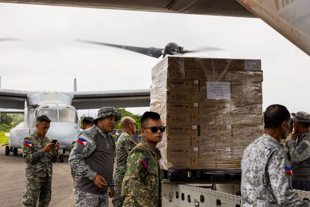 Philippine service members unload family food packs used for foreign disaster relief operations off of an MV-22B Osprey assigned to Marine Medium Tiltrotor Squadron (VMM) 363, Marine Rotational Force - Darwin 25.3, at Batanes, Philippines, Aug. 3, 2025. At the request of the Government of the Philippines, the MRF-D 25.3 Marine Air-Ground Task Force is working alongside the Armed Forces of the Philippines to provide foreign disaster relief to communities affected by consecutive storms and the southwest monsoon. The forward presence and ready posture of United States Indo-Pacific Command in the region facilitates rapid and effective response to crisis, demonstrating the U.S.’s commitment to Allies and partners during times of need. MRF-D is an annual six-month rotational deployment to enhance interoperability with the Australian Defence Force and allies and partners and provide a forward postured crisis response force in the Indo-Pacific. (U.S. Marine Corps photo by Cpl. Angelina Sara)