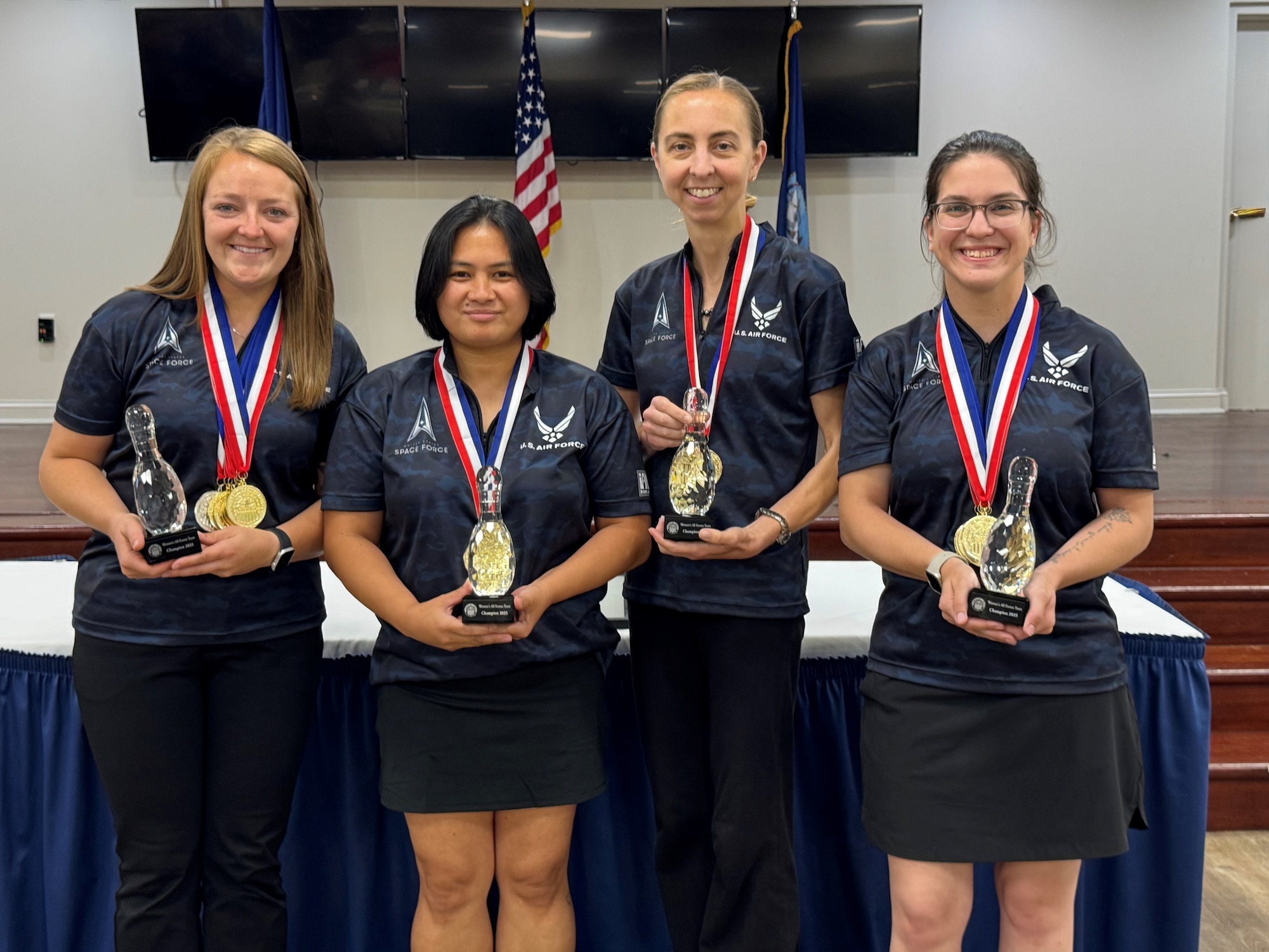 Lt Col Crowder poses with Air Force bowling team members.
