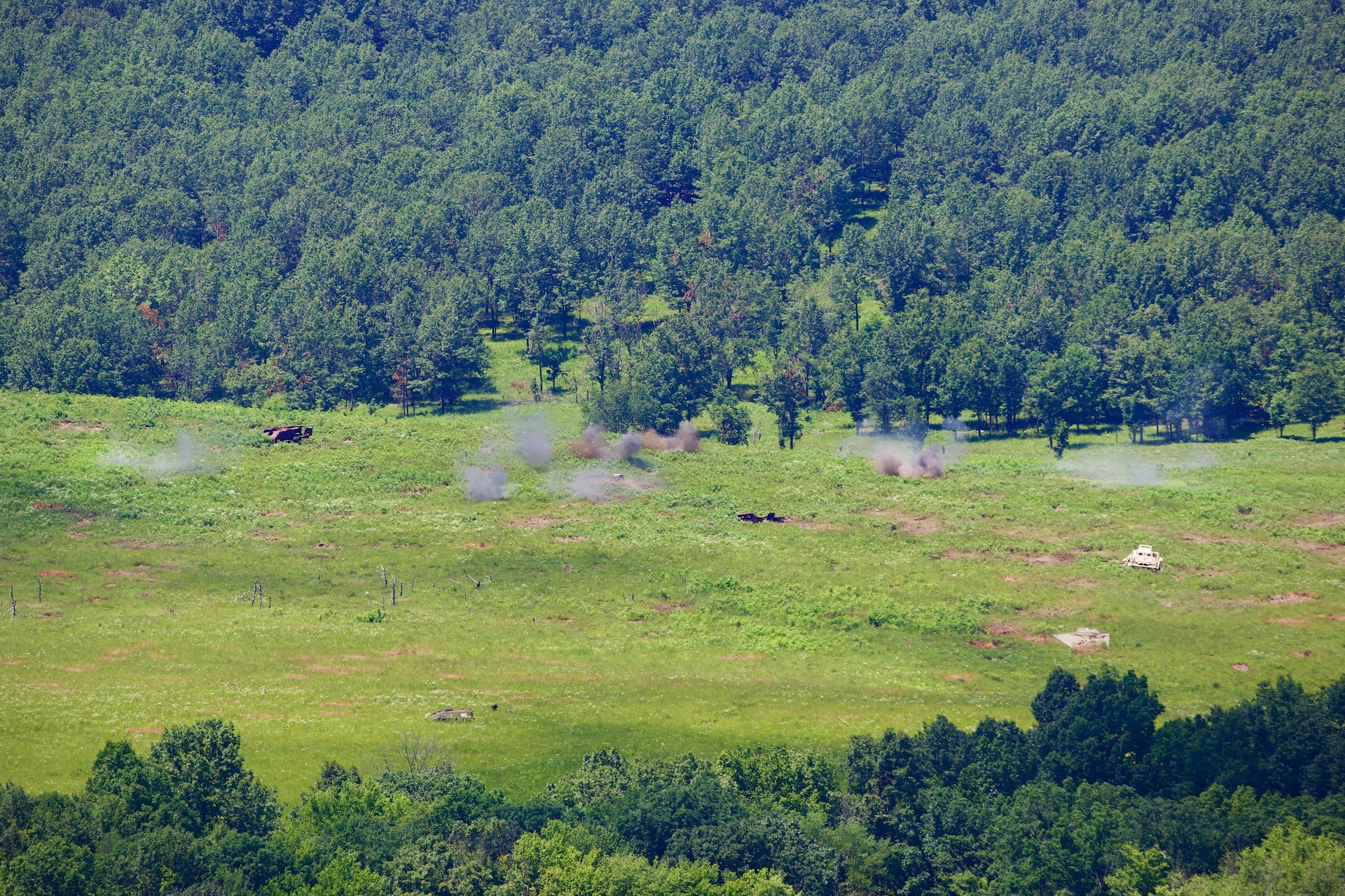 U.S. Soldiers with 1st Battalion, 109th Infantry Regiment, 2nd Infantry Brigade Combat Team, 28th Infantry Division operate an unmanned aerial system and call for artillery fire during a demonstration at Fort Indiantown Gap, Pennsylvania, July 28, 2025. The Soldiers and representatives from Carnegie Mellon University’s Software Engineering Institute demonstrated Project Shrike, an AI-enabled system for rapid target recognition and fire adjustment, by integrating drones and artillery during live-fire training. (U.S. Army National Guard photo by Maj. Travis Mueller)