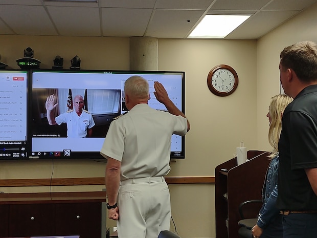 Capt. Jonathan Townsend is promoted to the rank of Rear Admiral in a ceremony on Aug. 7, 2025. The oath was administered via a virtual meeting with his family and some Navy Region Northwest staff in attendance.