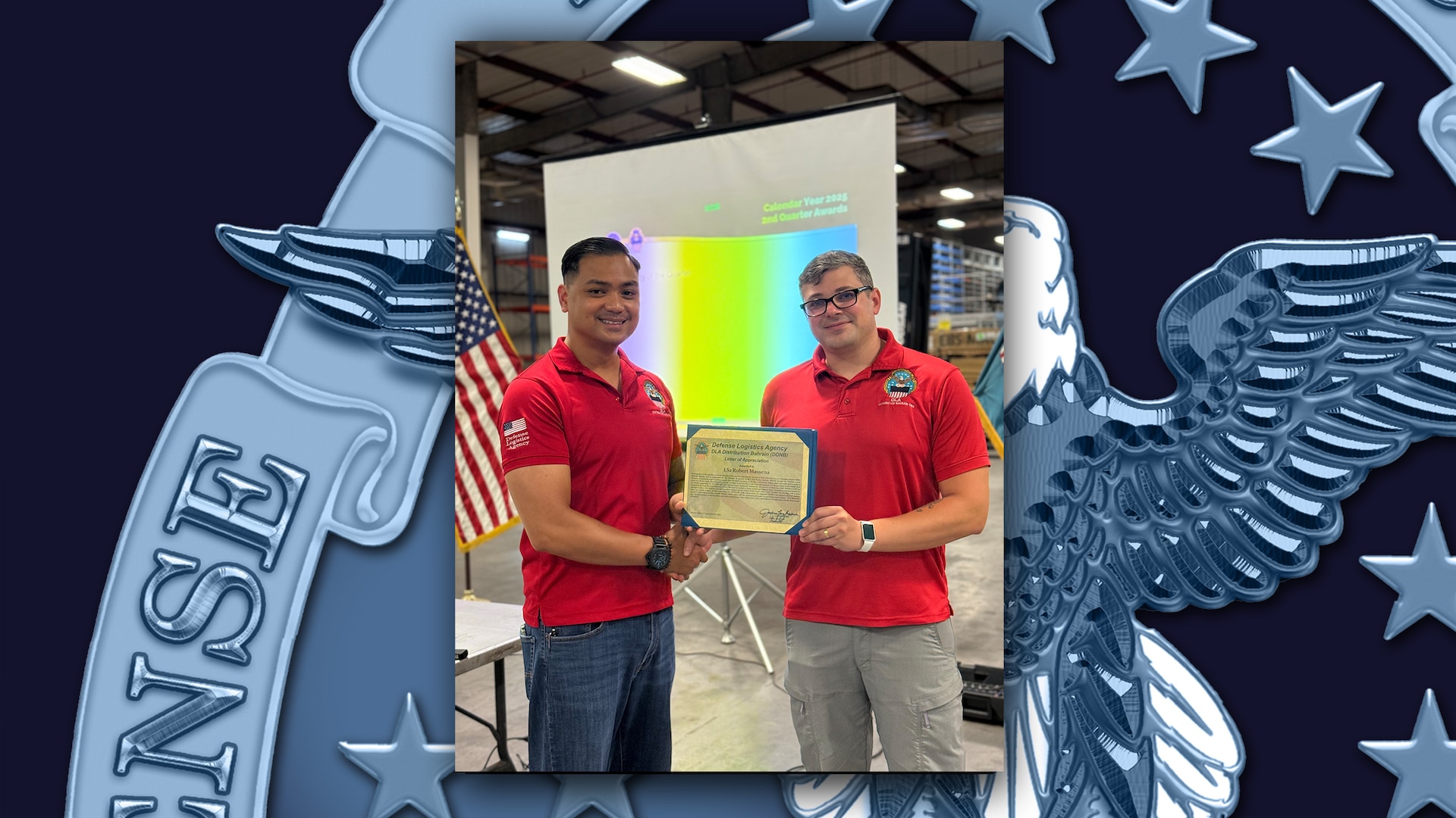 Employee receives an award in a warehouse.