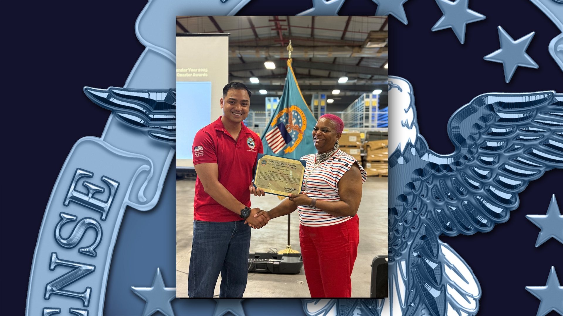 Employee receives an award in a warehouse.