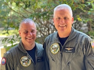 Capt. Jason Sherman, left. and Rear Adm. Jonathan Townsend pose for a photo before Capt. Sherman turns over command of Navy Region Northwest to Rear Adm. Townsend.