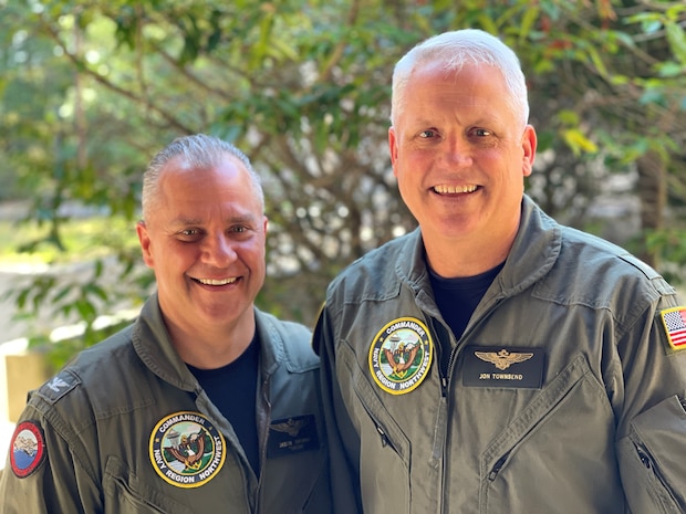 Capt. Jason Sherman, left. and Rear Adm. Jonathan Townsend pose for a photo before Capt. Sherman turns over command of Navy Region Northwest to Rear Adm. Townsend.